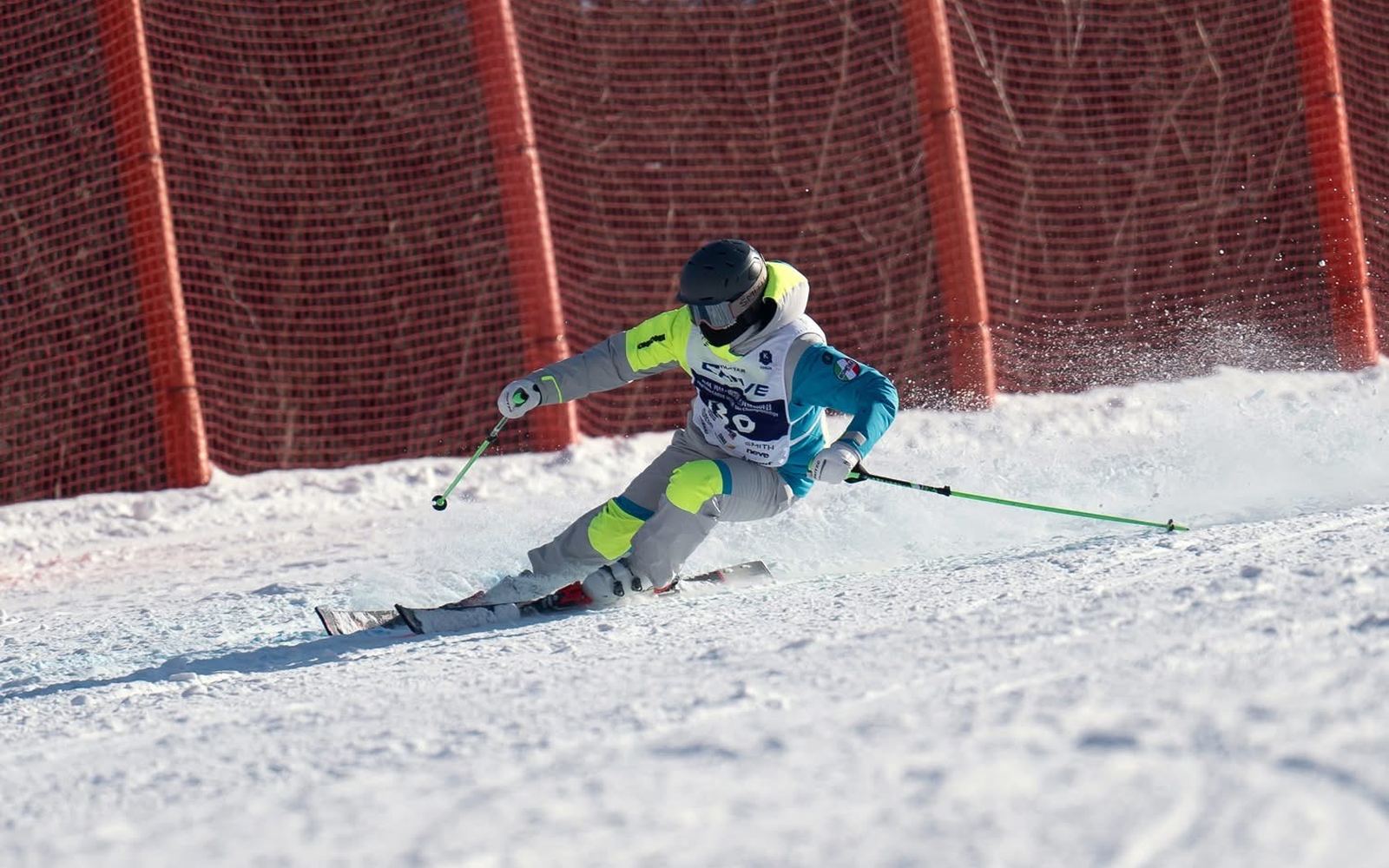 A junior skier passing through race gates